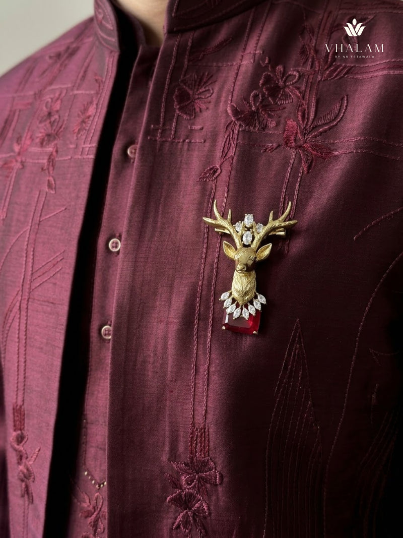 Gold-Tone Stag Head Brooch with Red Accent, styled view