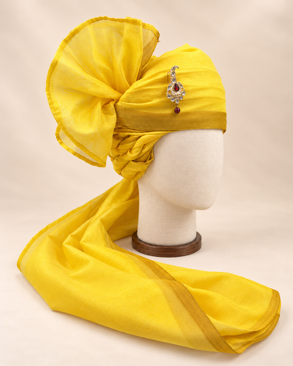 Right side view of sunshine yellow gold border premium barati safa showing twisted folds and fan detail