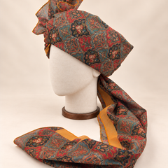 Left side view of teal coral floral paisley Barati Safa showing its wrap and mustard-bordered tail
